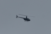 Morten 22 juni 2020 - Robinson R44 over Høyenhall, den er litt for langt unna for å se hvem det er