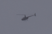 Morten 5 desember 2021 - Robinson R44 over Høyenhall, klokken er 11.44. Det er ikke rare sikten i dag og den er litt langt unna