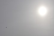 Morten 7 april 2022 - Politihelikopter og solen over Høyenhall, ikke helt i nærheten, men nesten godkjent