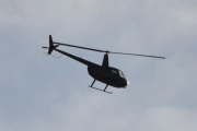 Morten 9 oktober 2022 - Robinson R44 over Høyenhall, men nå er den på vei mot solen