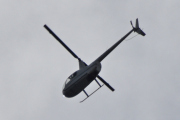Morten 14 september 2023 - Robinson R44 over Høyenhall, her ble det mye motlys, men jeg gjetter på at det er European Helicopter Center eller Skytec som er ute
