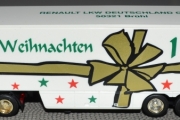 RENAULT Magnum 1997 weib mit goldener Scheife und Weihnachtsmann