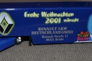RENAULT Premium 2001 dunkelblau mit grober, silberfarbenen RENAULT-ROMBE und Prostschenkenden Weihnachtsmann im Schnee